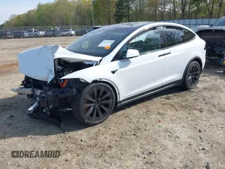 2022 Tesla Model X Plaid z VIN 7SAXCBE6XNF340704, wystawiony jako IAAI lot #41928524 z przebiegiem Nie podano mil oraz . Historia ofert i sprzedaży dostępna na DreamBid. Obrazek 2.