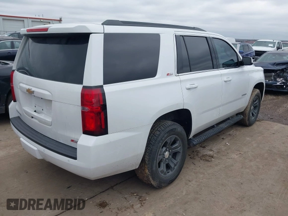 2017 Chevrolet Tahoe LT with VIN 1GNSKBKC1HR401044, listed as a IAAI auction lot 41573362 with 103,865 mi miles and . Bid and sale history available at DreamBid. Image 4.