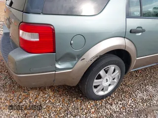2005 Ford Freestyle SE with VIN 1FMZK01195GA74424, listed as a IAAI auction lot 41671994 with 238,292 mi miles. Bid and sale history available at carsss.com. Image 6.