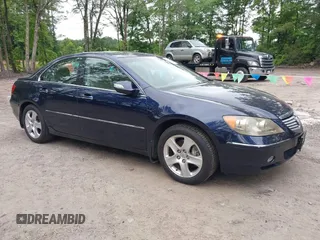 2006 Acura RL z VIN JH4KB16566C007214, wystawiony jako IAAI lot #42510457 z przebiegiem 160 005 mil mil oraz . Historia ofert i sprzedaży dostępna na DreamBid. Obrazek 1.