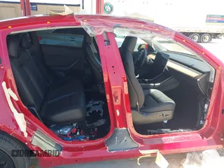 2020 Tesla Model Y Long Range with VIN 5YJYGDEE0LF029496, listed as a IAAI auction lot 41977695 with 47,958 mi miles and . Bid and sale history available at DreamBid. Image 6.