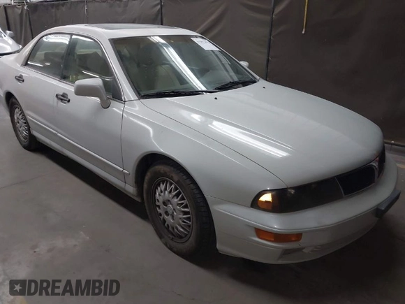 1999 Mitsubishi Diamante z VIN 6MMAP47P4XT003895, wystawiony jako IAAI lot #41992452 z przebiegiem 170 964 mil mil oraz . Historia ofert i sprzedaży dostępna na DreamBid. Obrazek 1.
