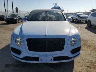 2019 Bentley Bentayga V8 z VIN SJAAM2ZV9KC026988, wystawiony jako Copart lot #73576964 z przebiegiem 31 162 mil mil oraz Szkoda całkowita • Salvage title. Historia ofert i sprzedaży dostępna na DreamBid. Obrazek 5.