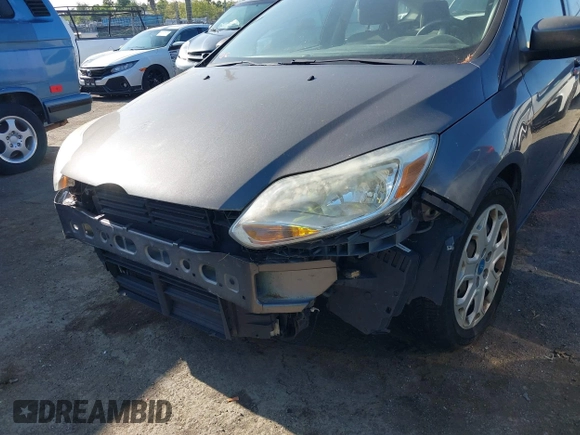 2012 Ford Focus SE z VIN 1FAHP3K23CL366865, wystawiony jako IAAI lot #42140894 z przebiegiem 168 754 mil mil oraz . Historia ofert i sprzedaży dostępna na DreamBid. Obrazek 6.
