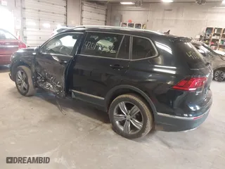 2020 Volkswagen Tiguan SE with VIN 3VV2B7AX4LM115131, listed as a IAAI auction lot 42017352 with 87,909 mi miles. Bid and sale history available at carsss.com. Image 3.