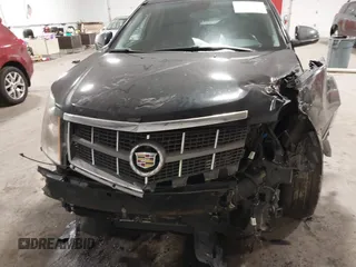 2011 Cadillac SRX Performance Collection with VIN 3GYFNEEY9BS533994, listed as a IAAI auction lot 40990072 with 168,134 mi miles. Bid and sale history available at carsss.com. Image 6.