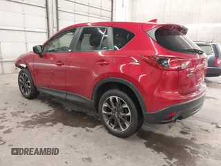 2016 Mazda CX-5 Grand Touring with VIN JM3KE4DY7G0731057, listed as a IAAI auction lot 41118072 with 134,107 mi miles and . Bid and sale history available at carsss.com. Image 3.