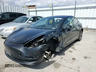 2023 Tesla Model 3 with VIN 5YJ3E1EAXPF708001, listed as a Copart auction lot 57252735 with 71,579 mi miles and Salvage title. Bid and sale history available at DreamBid. Image 13.