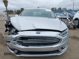 2017 Ford Fusion Energi SE with VIN 3FA6P0PU9HR354096, listed as a IAAI auction lot 42064703 with 69,601 mi miles. Bid and sale history available at carsss.com. Image 12.
