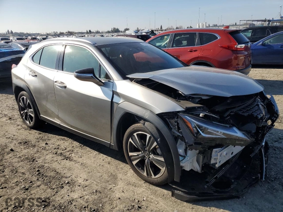 2022 Lexus UX with VIN JTHX3JBHXN2056083, listed as a Copart auction lot 87941385 with 8,469 mi miles and Salvage Title. Bid and sale history available at carsss.com. Image 4.
