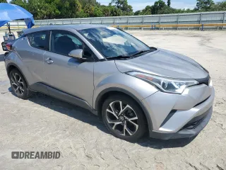 2018 Toyota C-HR XLE with VIN NMTKHMBX7JR021704, listed as a Copart auction lot 71171874 with 82,872 mi miles and Salvage Title. Bid and sale history available at DreamBid. Image 4.