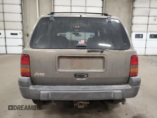 1998 Jeep Grand Cherokee Laredo with VIN 1J4GZ58S3WC207166, listed as a Copart auction lot 84243704 with 124,084 mi miles and Salvage Title. Bid and sale history available at carsss.com. Image 6.