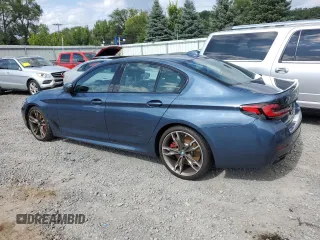 2023 BMW 5 Series M550i xDrive z VIN WBA13BK02PCN82953, wystawiony jako Copart lot #68124264 z przebiegiem 10 010 mil mil oraz Szkoda całkowita • Salvage title. Historia ofert i sprzedaży dostępna na DreamBid. Obrazek 2.