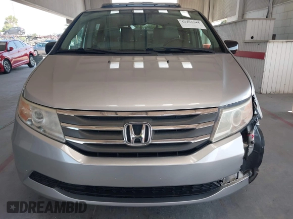 2012 Honda Odyssey EX-L with VIN 5FNRL5H67CB005013, listed as a IAAI auction lot 42295586 with 200,611 mi miles and . Bid and sale history available at DreamBid. Image 12.