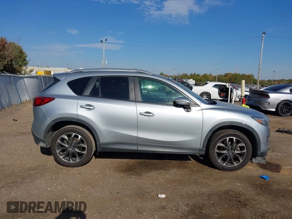 2016 Mazda CX-5 Grand Touring z VIN JM3KE2DY3G0712249, wystawiony jako IAAI lot #37910910 z przebiegiem 262 058 mil mil oraz . Historia ofert i sprzedaży dostępna na DreamBid. Obrazek 13.
