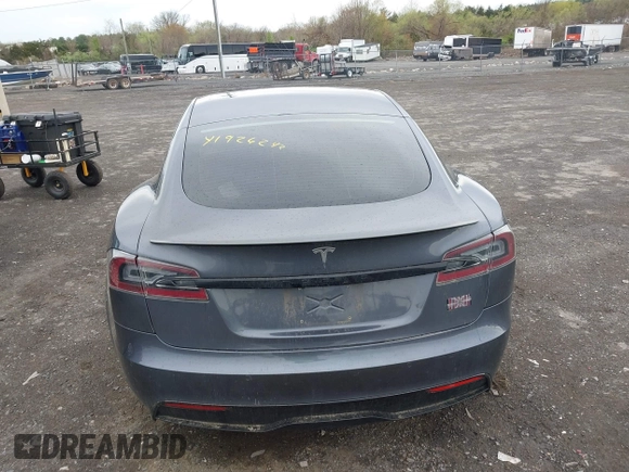 2021 Tesla Model S Long Range with VIN 5YJSA1E5XMF428519, listed as a IAAI auction lot 41926242 with 54,284 mi miles and . Bid and sale history available at DreamBid. Image 16.