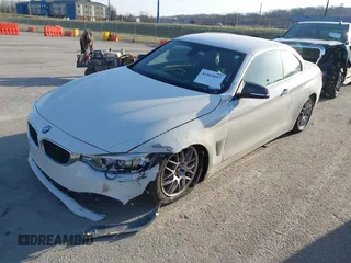 2015 BMW 4 Series 428i xDrive with VIN WBA3T1C51FP821140, listed as a IAAI auction lot 41802697 with 95,232 mi miles and . Bid and sale history available at carsss.com. Image 2.