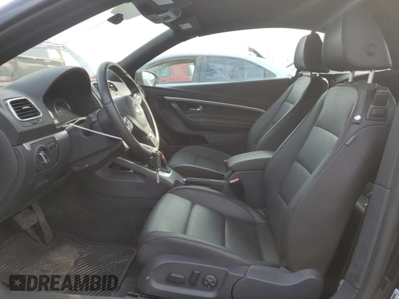 2015 Volkswagen Eos Komfort with VIN WVWBW8AH4FV001321, listed as a Copart auction lot 78718404 with 73,296 mi miles and Salvage Title. Bid and sale history available at DreamBid. Image 7.