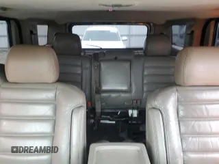 2004 Hummer H2 with VIN 5GRGN23U24H118230, listed as a Copart auction lot 87764075 with 202,206 mi miles and Salvage Title. Bid and sale history available at carsss.com. Image 10.