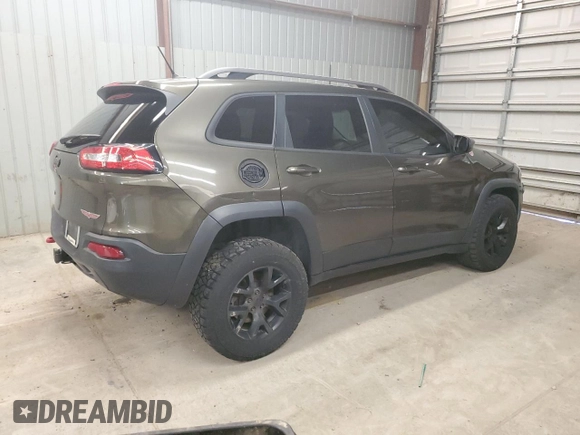 2015 Jeep Cherokee Trailhawk z VIN 1C4PJMBS8FW665607, wystawiony jako Copart lot #51536715 z przebiegiem 166 443 mil mil oraz Szkoda całkowita • Salvage title. Historia ofert i sprzedaży dostępna na DreamBid. Obrazek 3.