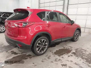 2016 Mazda CX-5 Grand Touring with VIN JM3KE4DY7G0731057, listed as a IAAI auction lot 41118072 with 134,107 mi miles and . Bid and sale history available at carsss.com. Image 4.