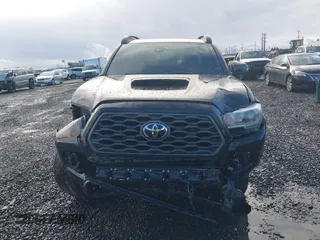 2020 Toyota Tacoma SR5 z VIN 5TFCZ5AN9LX216032, wystawiony jako IAAI lot #41448197 z przebiegiem 128 581 mil mil oraz . Historia ofert i sprzedaży dostępna na DreamBid. Obrazek 13.
