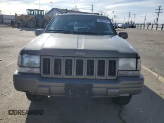 1997 Jeep Grand Cherokee Limited with VIN 1J4GZ78Y4VC754624, listed as a Copart auction lot 49884435 with 144,682 mi miles and Salvage Title. Bid and sale history available at carsss.com. Image 5.