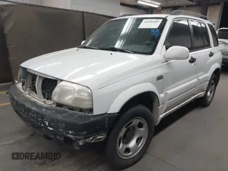 2002 Suzuki Grand Vitara JLX z VIN JS3TD62V824156720, wystawiony jako IAAI lot #42058409 z przebiegiem Nie podano mil oraz . Historia ofert i sprzedaży dostępna na DreamBid. Obrazek 2.