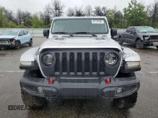 2023 Jeep Wrangler Rubicon with VIN 1C4JJXFM4PW589923, listed as a Copart auction lot 58725465 with 9,814 mi miles and Salvage title. Bid and sale history available at DreamBid. Image 5.