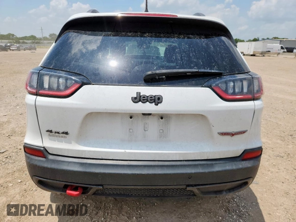2020 Jeep Cherokee Trailhawk z VIN 1C4PJMBN0LD553823, wystawiony jako Copart lot #59796745 z przebiegiem 101 916 mil mil oraz Szkoda całkowita • Salvage title. Historia ofert i sprzedaży dostępna na DreamBid. Obrazek 6.