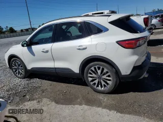 2021 Ford Escape Titanium Hybrid z VIN 1FMCU0DZ5MUB04522, wystawiony jako Copart lot #49127385 z przebiegiem 66 996 mil mil oraz Szkody całkowita. Historia ofert i sprzedaży dostępna na DreamBid. Obrazek 2.