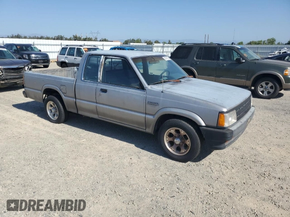 1993 Mazda B-Series Truck z VIN JM2UF3130P0378304, wystawiony jako Copart lot #58799925 z przebiegiem 132 801 mil mil oraz Szkoda całkowita • Salvage title. Historia ofert i sprzedaży dostępna na DreamBid. Obrazek 4.