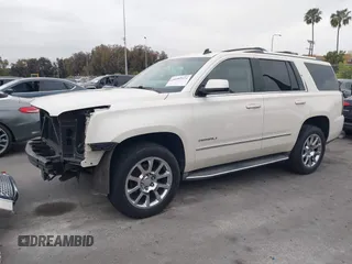 2015 GMC Yukon Denali with VIN 1GKS2CKJ9FR294551, listed as a IAAI auction lot 42162654 with 106,063 mi miles. Bid and sale history available at carsss.com. Image 2.