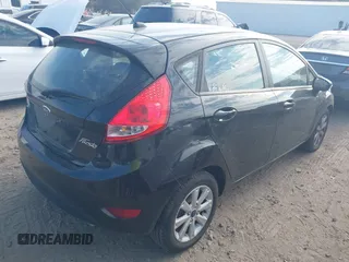 2013 Ford Fiesta SE with VIN 3FADP4EJ7DM140755, listed as a IAAI auction lot 41908366 with 68,744 mi miles. Bid and sale history available at carsss.com. Image 4.