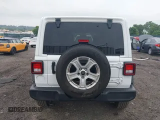 2021 Jeep Wrangler Unlimited Willys with VIN 1C4HJXDG9MW582361, listed as a IAAI auction lot 42243238 with 78,692 mi miles and . Bid and sale history available at DreamBid. Image 16.
