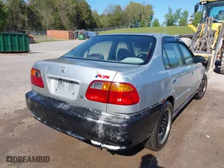1999 Honda Civic VP with VIN 2HGEJ6616XH537100, listed as a IAAI auction lot 42018708 with 229,594 mi miles. Bid and sale history available at carsss.com. Image 4.