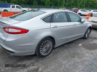 2013 Ford Fusion Titanium Hybrid with VIN 3FA6P0RU3DR281914, listed as a IAAI auction lot 42380838 with 166,956 mi miles and . Bid and sale history available at DreamBid. Image 4.
