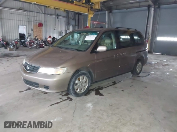 2003 Honda Odyssey EX-L with VIN 5FNRL18923B117592, listed as a IAAI auction lot 41546119 with 212,755 mi miles and . Bid and sale history available at DreamBid. Image 2.