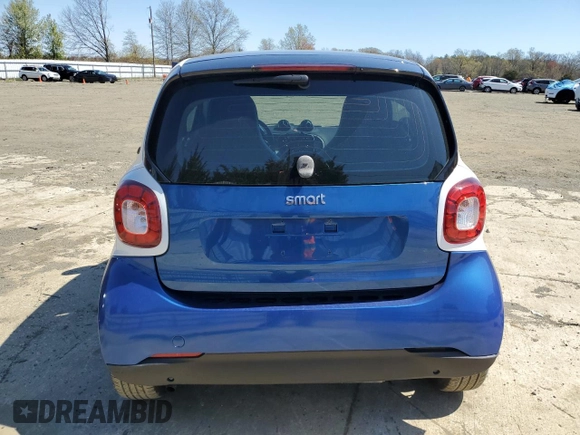 2016 Smart fortwo Passion z VIN WMEFJ5DA6GK064695, wystawiony jako Copart lot #53528315 z przebiegiem 53 508 mil mil oraz Szkody całkowita. Historia ofert i sprzedaży dostępna na DreamBid. Obrazek 6.