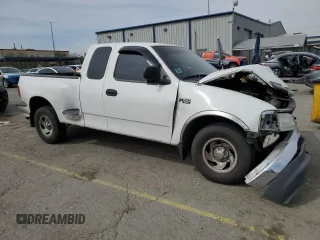 1999 Ford F-150 XL with VIN 1FTZX0721XKA49751, listed as a Copart auction lot 52429195 with Not provided miles and Salvage title. Bid and sale history available at DreamBid. Image 4.