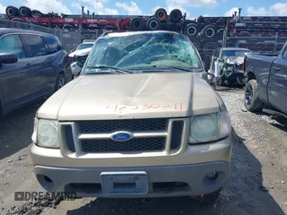 2003 Ford Explorer Sport Trac XLS z VIN 1FMZU77E23UC35868, wystawiony jako IAAI lot #42530211 z przebiegiem 223 483 mil mil oraz . Historia ofert i sprzedaży dostępna na DreamBid. Obrazek 12.