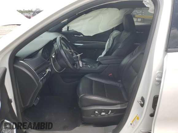 2020 Cadillac XT4 FWD Sport with VIN 1GYFZER49LF123830, listed as a Copart auction lot 55737985 with 98,871 mi miles and Salvage title. Bid and sale history available at DreamBid. Image 7.