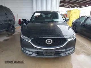 2021 Mazda CX-5 Signature with VIN JM3KFBEY5M0432033, listed as a IAAI auction lot 41607215 with 49,870 mi miles. Bid and sale history available at carsss.com. Image 12.