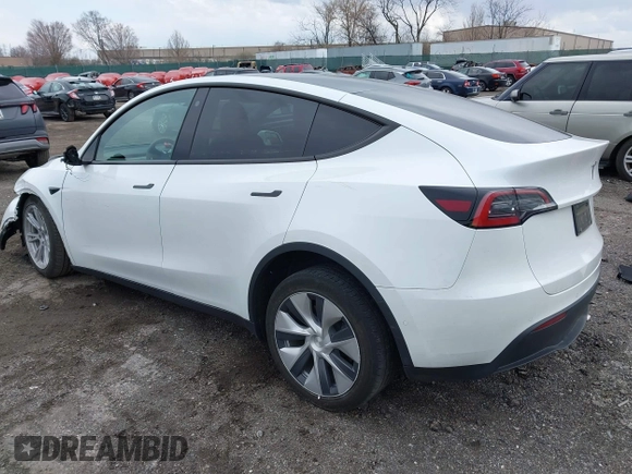 2022 Tesla Model Y Long Range with VIN 7SAYGAEE4NF516625, listed as a IAAI auction lot 41892225 with 33,054 mi miles and . Bid and sale history available at DreamBid. Image 3.