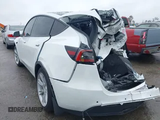 2021 Tesla Model Y Long Range with VIN 5YJYGAEE2MF260142, listed as a IAAI auction lot 41808666 with 87,316 mi miles and . Bid and sale history available at DreamBid. Image 3.