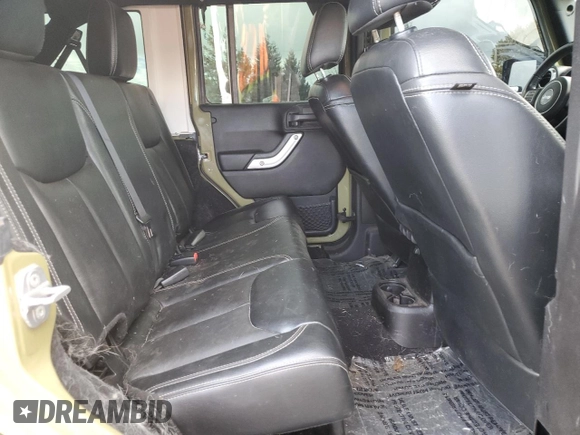 2013 Jeep Wrangler Unlimited Rubicon 10th Anniversary with VIN 1C4HJWFG4DL549065, listed as a Copart auction lot 75899594 with 127,960 mi miles and Salvage title. Bid and sale history available at DreamBid. Image 10.