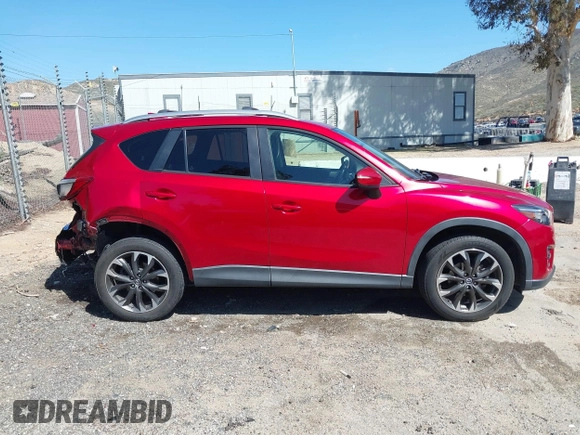 2016 Mazda CX-5 Grand Touring with VIN JM3KE2DY3G0686588, listed as a IAAI auction lot 41697312 with 65,090 mi miles. Bid and sale history available at carsss.com. Image 13.