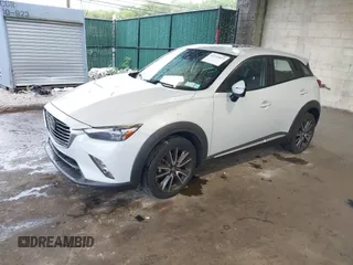 2016 Mazda CX-3 Grand Touring z VIN JM1DKBD71G0126151, wystawiony jako IAAI lot #42215837 z przebiegiem 81 349 mil mil oraz . Historia ofert i sprzedaży dostępna na DreamBid. Obrazek 2.