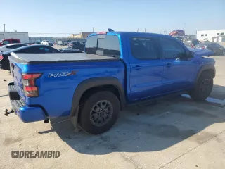 2024 Nissan Frontier Pro-X z VIN 1N6ED1EJ2RN646428, wystawiony jako Copart lot #44304215 z przebiegiem 5 853 mil mil oraz Szkoda całkowita • Salvage title. Historia ofert i sprzedaży dostępna na DreamBid. Obrazek 3.