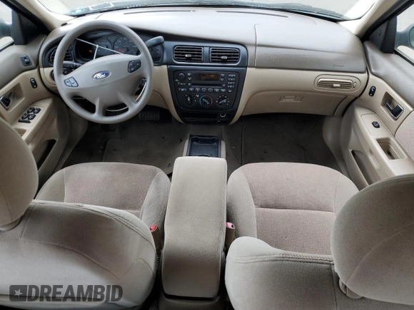 2002 Ford Taurus SE Standard z VIN 1FAFP53U92A246842, wystawiony jako Copart lot #57858765 z przebiegiem 64 545 mil mil oraz Czysty tytuł • Clean title. Historia ofert i sprzedaży dostępna na DreamBid. Obrazek 8.